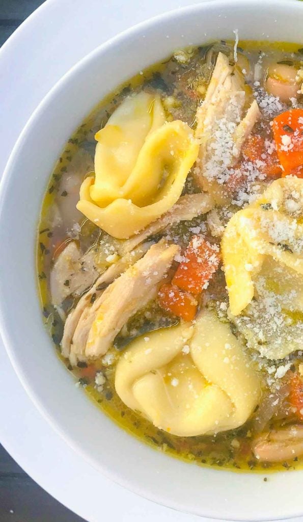 Homemade Chicken and Cheese Tortellini Soup is hearty and so easy to make. Made with rotesseri chicken, cheese filled tortellini, white beans, carrots, celery and herbs in a store bought broth.