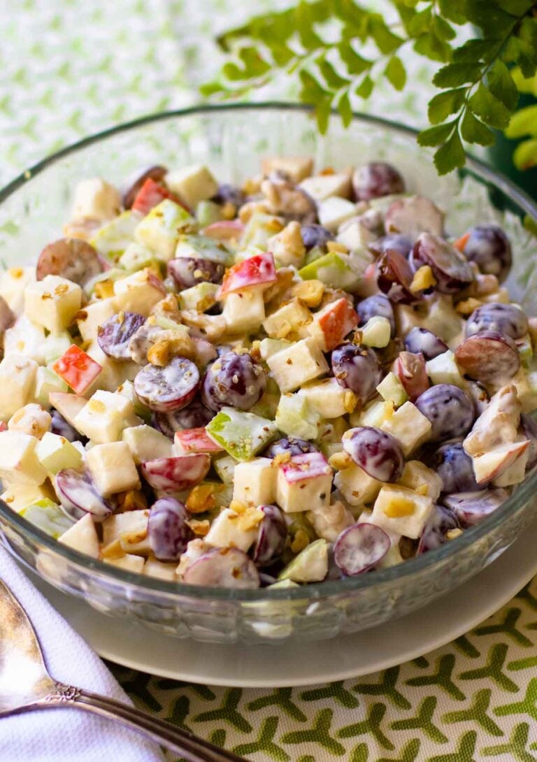 Waldorf Salad is a classic recipe that's great served any time of the year. Made with red and green apples, red seedless grapes, celery and walnuts. They are all tossed in a dressing of mayonnaise, sour cream, sugar and lemon juice.