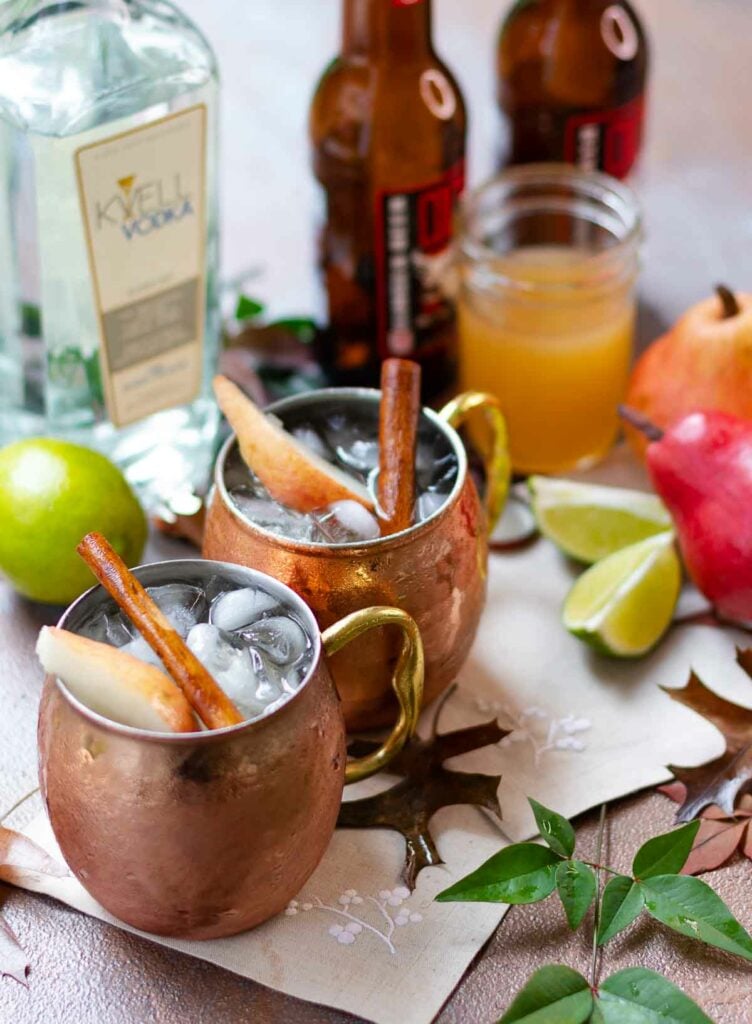 Spiced Pear Moscow Mule drink with lime, simple syrup, Kvell vodka and ginger beer.