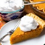 Classic Sweet Potato Pie with fresh whipped cream is an easy to make desssert.