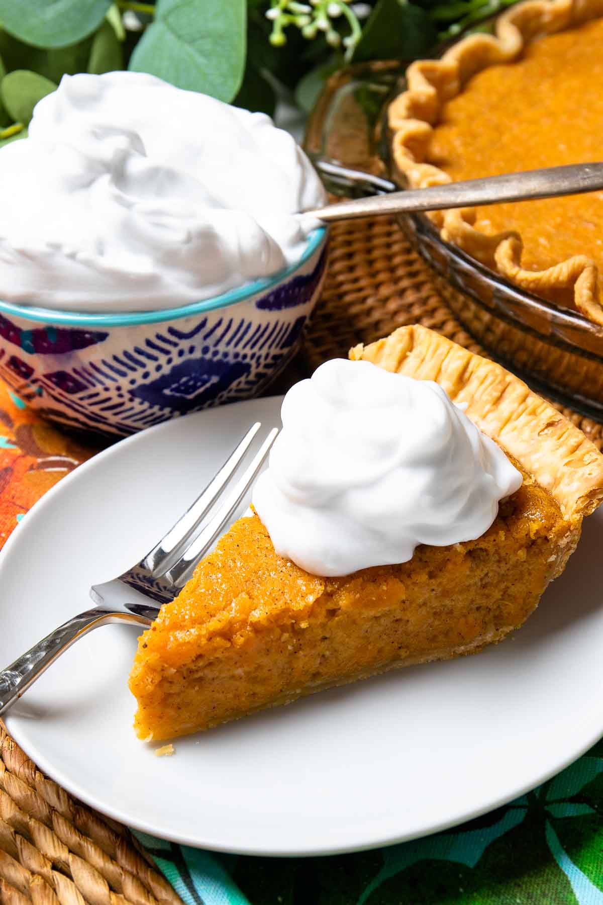 Classic Sweet Potato Pie with fresh whipped cream is an easy to make desssert.