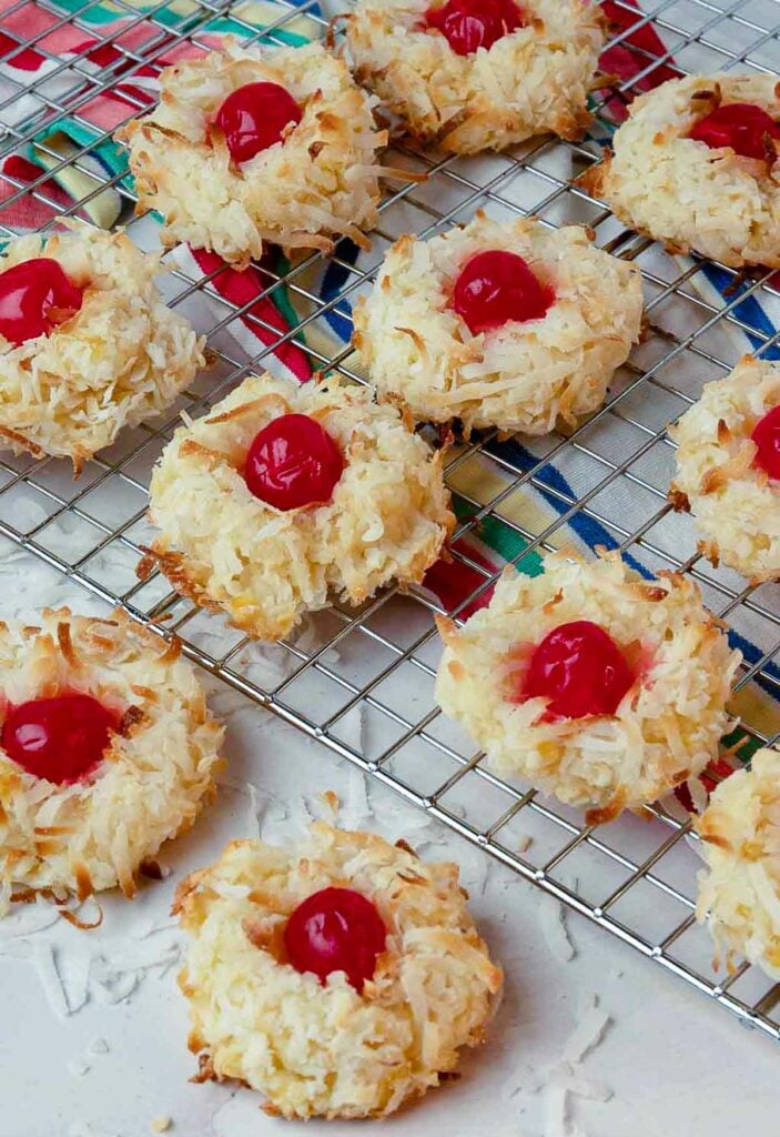Ambrosia Cookies made with cherries, coconut and pineapple cooling on a rack.