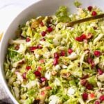 Brussels Sprouts Slaw in a bowl to serve as a side dish any time of the year.