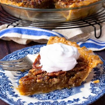 Sliced Maple Bourbon Pecan Pie on cooling rack and on plate.