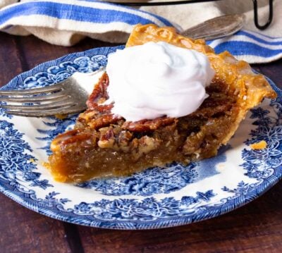 Sliced Maple Bourbon Pecan Pie on cooling rack and on plate.