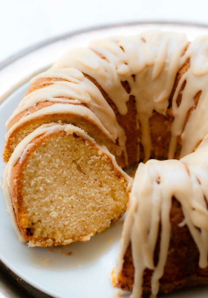 Buttermilk Pound Cake with brown butter icing sliced on a cake plate.