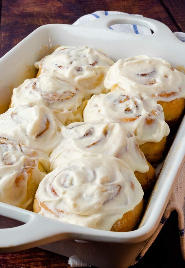 Easy Cinnamon Rolls in a white pan with cream cheese icing.