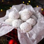 Snowball Cookies in a metal tin for gift giving at Christmas.
