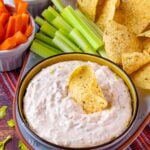 Southwest Ranch Dip served in a bowl with veggies and tortilla chips.