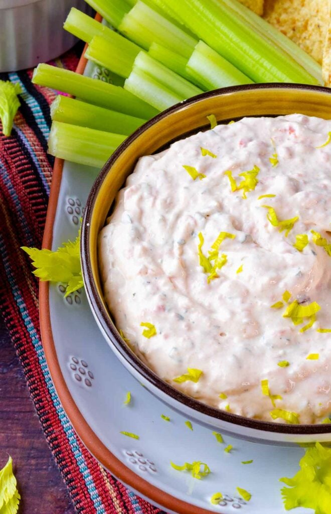 Bowl of Southwest Ranch Dip served with celery sticks.