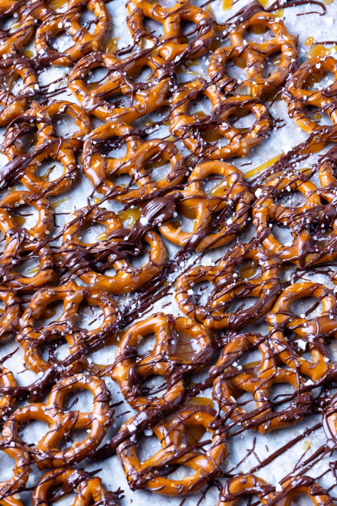 Pretzels drizzled with buttery caramel sauce and rich, dark chocolate, and a pinch of flakey sea salt creating a 4 ingredient masterpiece.