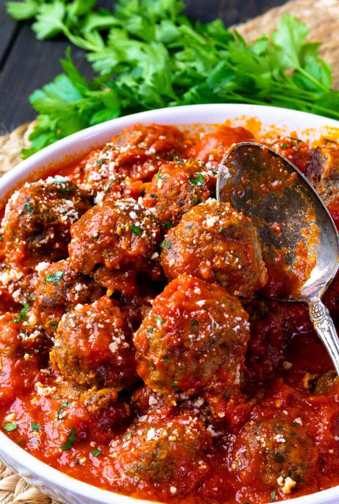 Homemade Meatballs in a easy to make tomato sauce in a bowl with a spoon.
