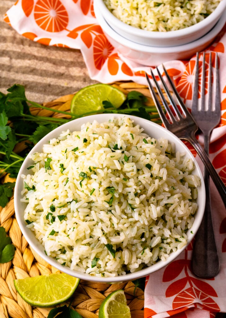 Instant Pot Coconut Lime Rice in a white bowl with forks.