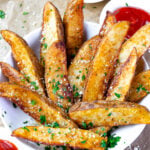 Bowl of potato wedges cooked in the air fryer.