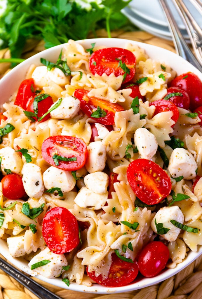 Ripe tomatoes and mozzarella pearls make the Best Caprese Pasta Salad.