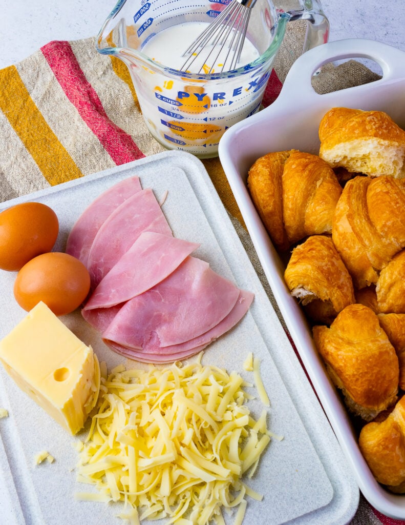 Ham, cheese, eggs and croissants for Ham and Cheese Croissant Breakfast Casserole