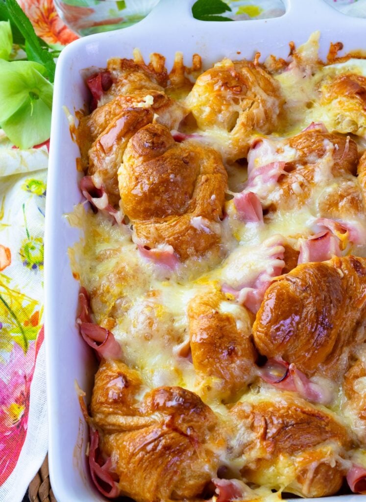 Ham and Cheese Croissant Breakfast Casserole in a white baking dish for breakfast or brunch