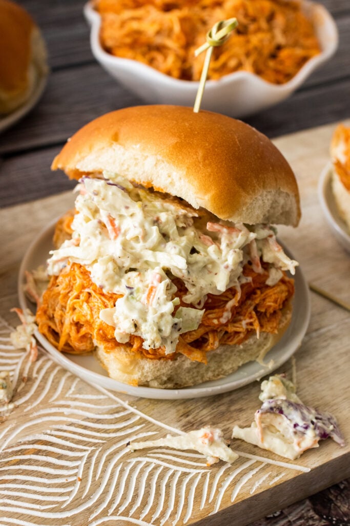 Buffalo Chicken Slider with slaw on a bun.