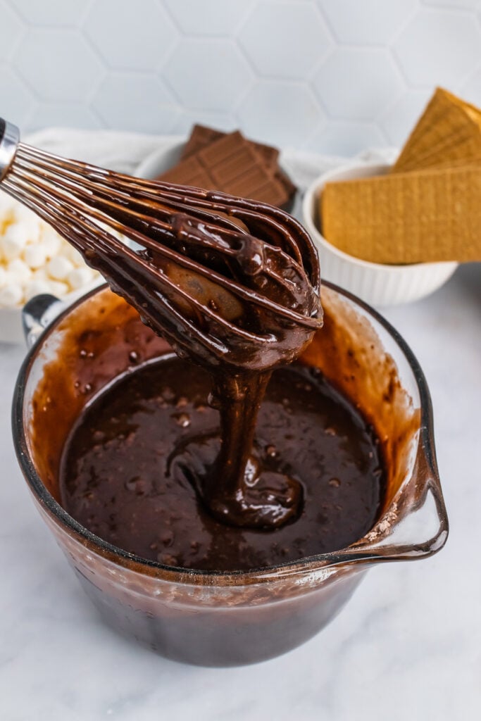Brownie mix in a bowl and whisk.