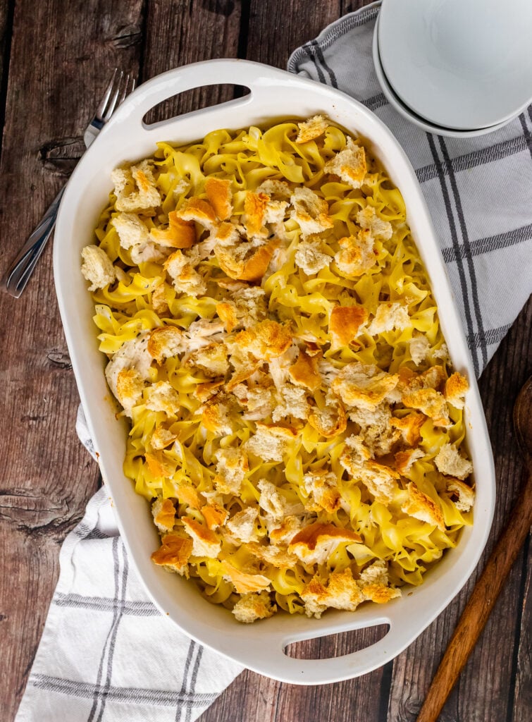 Creamy Chicken Casserole topped with breadcrumbs in a white baking dish.
