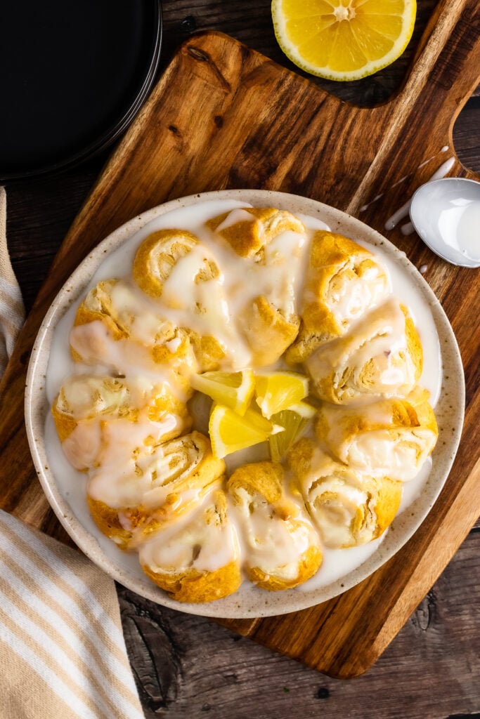Crescent Roll Crean Cheese Danish on a white plate with lemon slices.