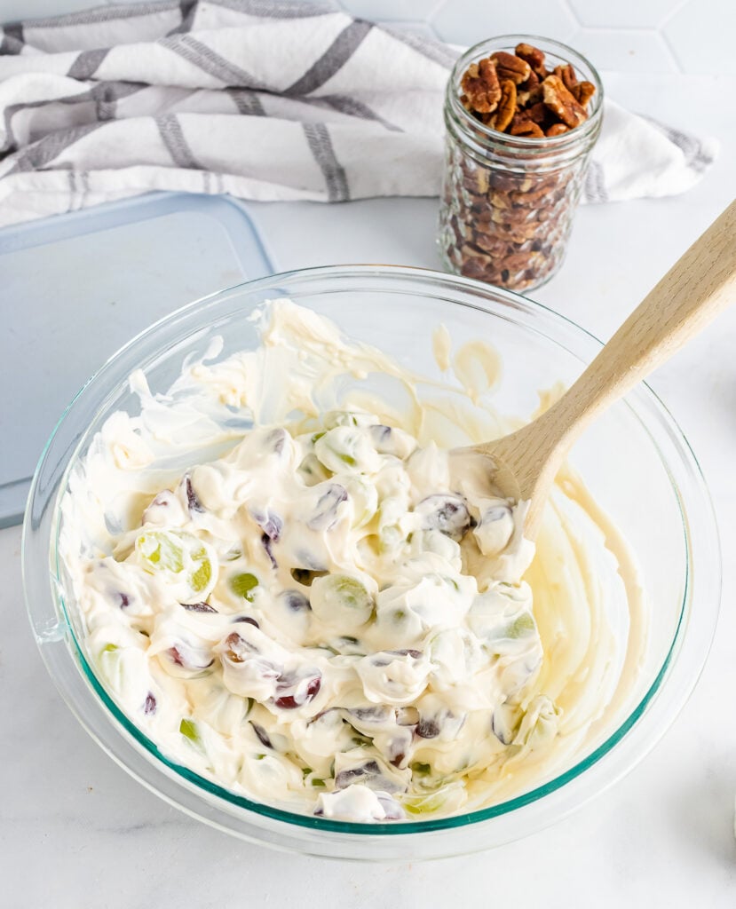 Grape salad with cream cheese and sour cream in a glass bowl.