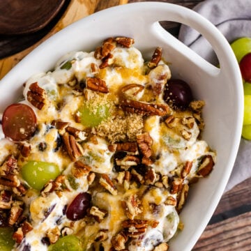 Grape Salad in a white bowl with a handle.