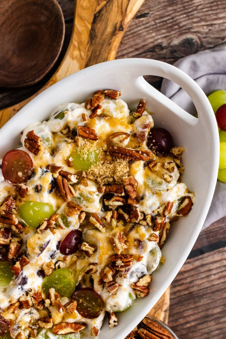 Grape Salad in a white bowl with a handle.