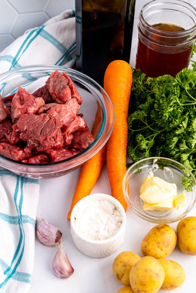 Ingrediets of beef, wine, carrots and potatoes for beef stew
