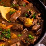 Skillet Beef Stew in a pan with wooden spoon