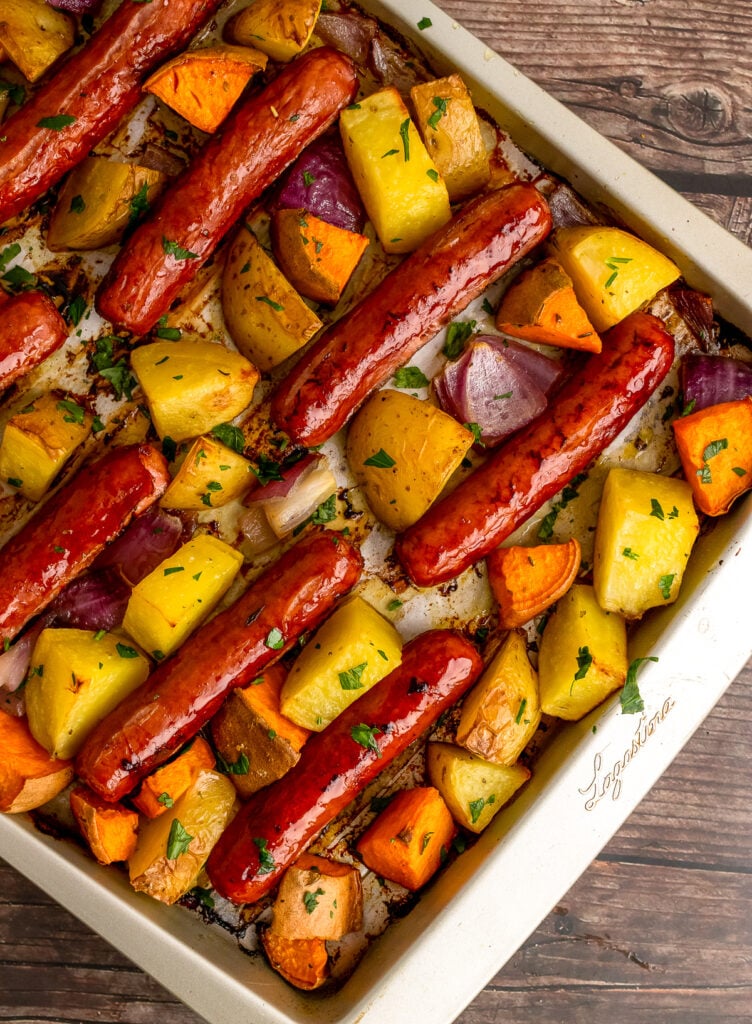 Sheet Pan Brats and Potatoes on a metal sheet pan.