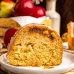 Slice of Apple Spice Cake on a white plate.