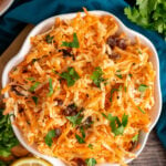 Carrot Apple Salad with raisins and fresh parsley.