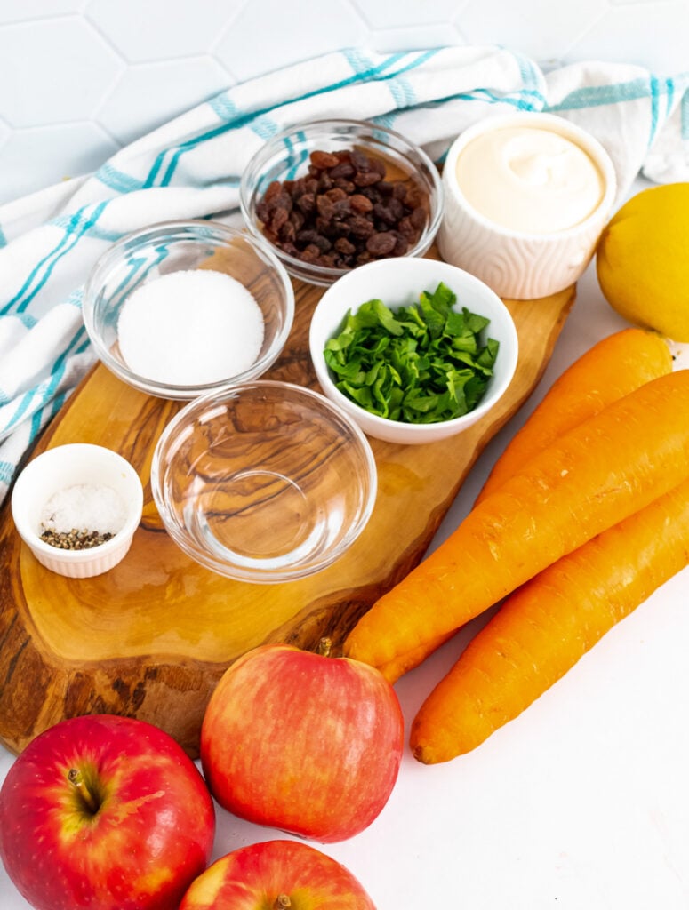 Carrots, apples and seasoning for Carrot Apple Salad