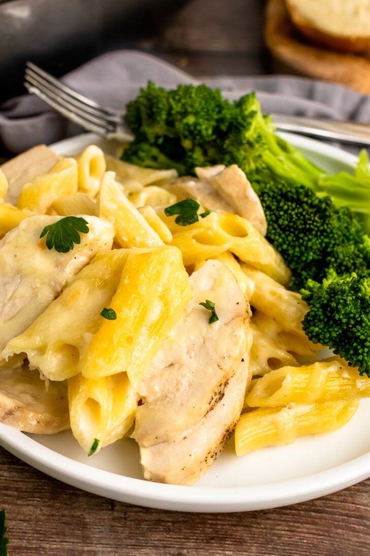 Close Chicken Alfredo Bake with broccoli and a fork.