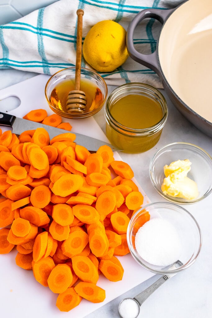 Carrots, honey, chicken stock, butter, lemon and salt for honey glazed carrot recipe.