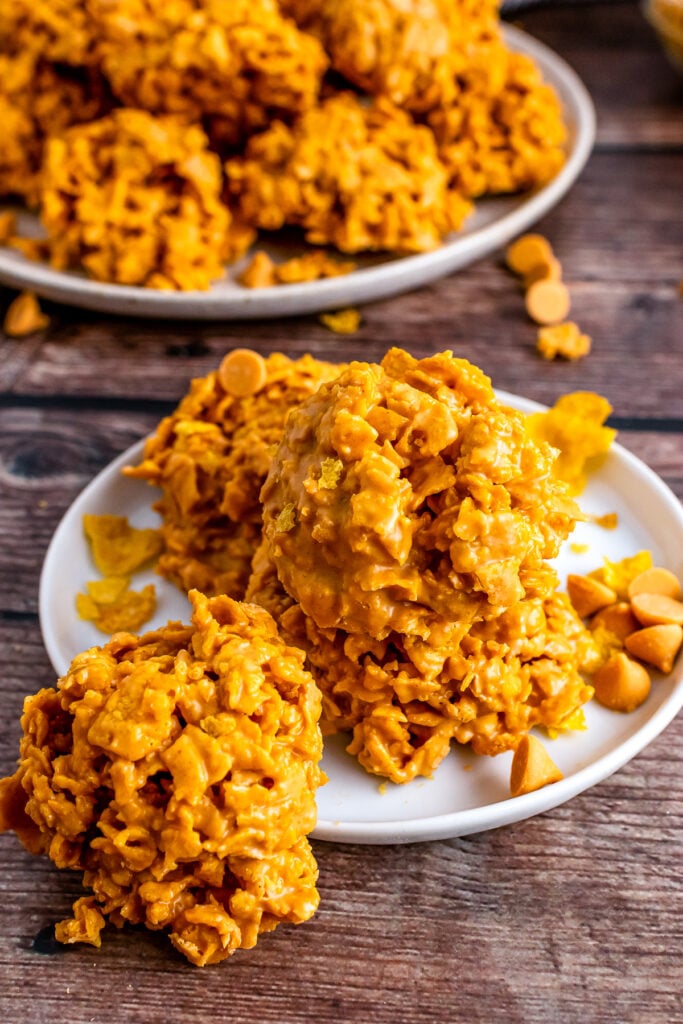 Butterscotch cookies made with peanut butter and corn chips on a white plate.