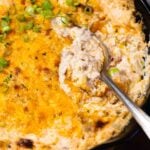 Baked ground beef casserole with melted cheddar cheese and green onions in black skillet, IMG 0638