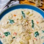 Creamy Gnocchi Chicken Soup in a blue bowl.