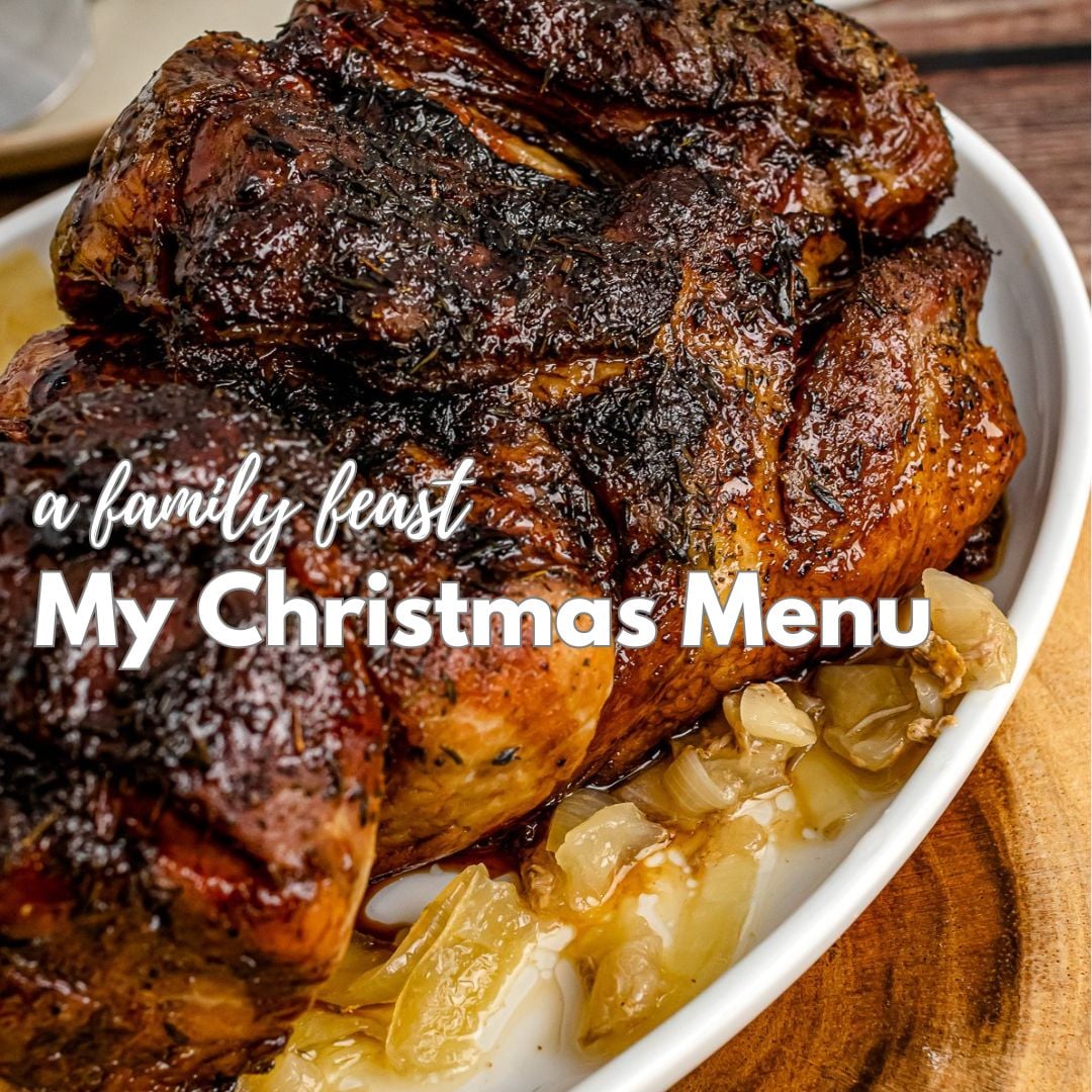 Glazed ham with caramelized pineapple on white plate for A Family Feast: My Christmas Dinner Menu Pinterest pin