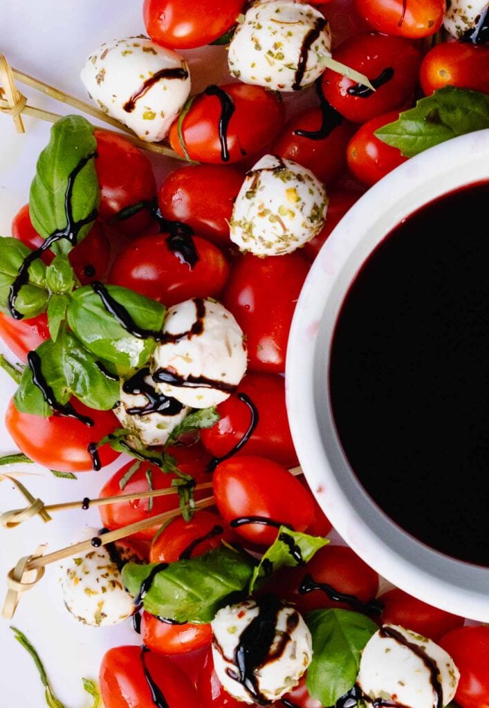 Caprese Wreath served with balsamic reduction for Christmas.
