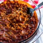 Spoon serving Chipotle Bacon Baked Beans
