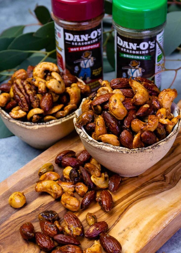 Bowls of Sweet And Spicy Roasted Nuts made with Dan-O's Seasoning.