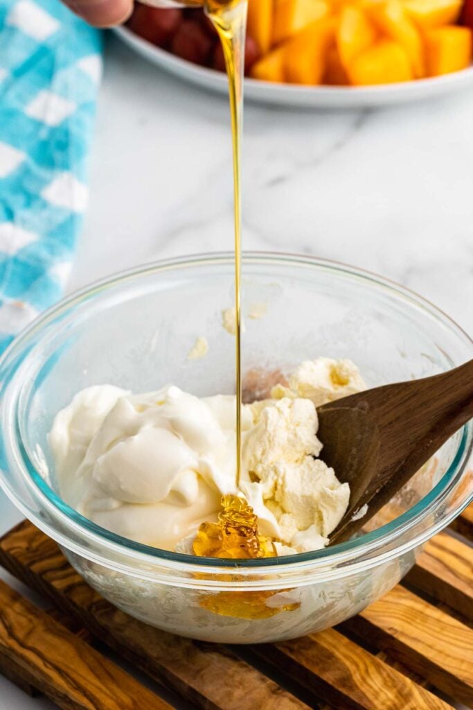Honey pour with cream cheese and sour cream for fruit dip.