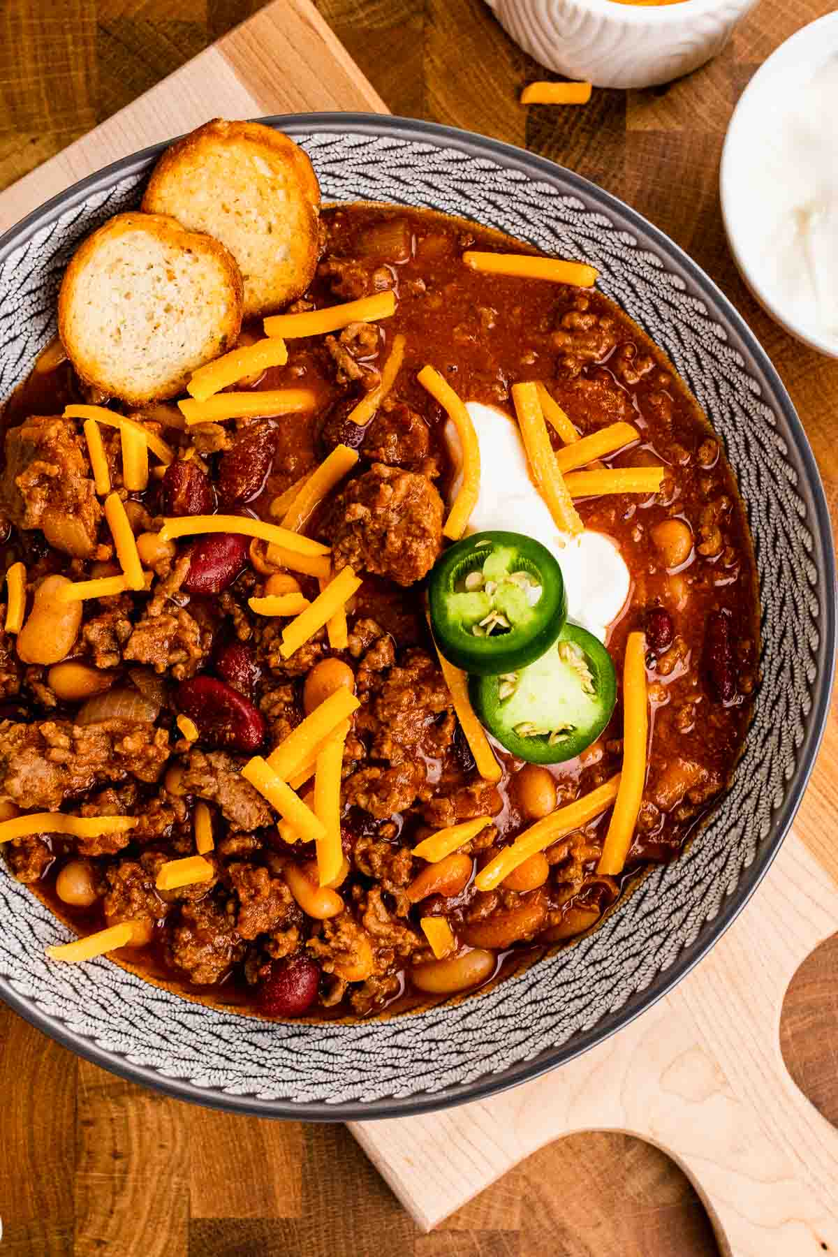Jalapeños, cheese, and sour cream topping Bloody Mary Chili.