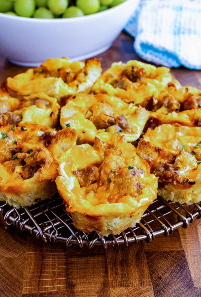 Breakfast Cupcakes on a cooling rack served with green grapes.