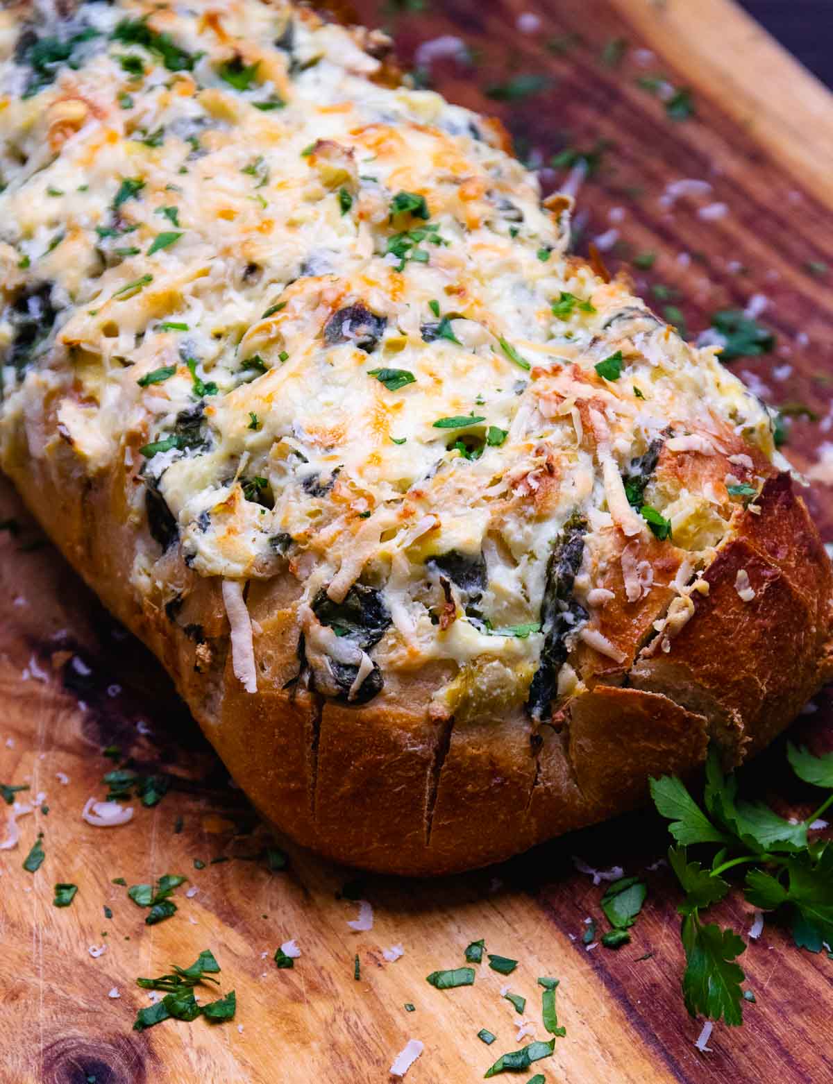 Loaf of spinach artichoke stuffed bread.
