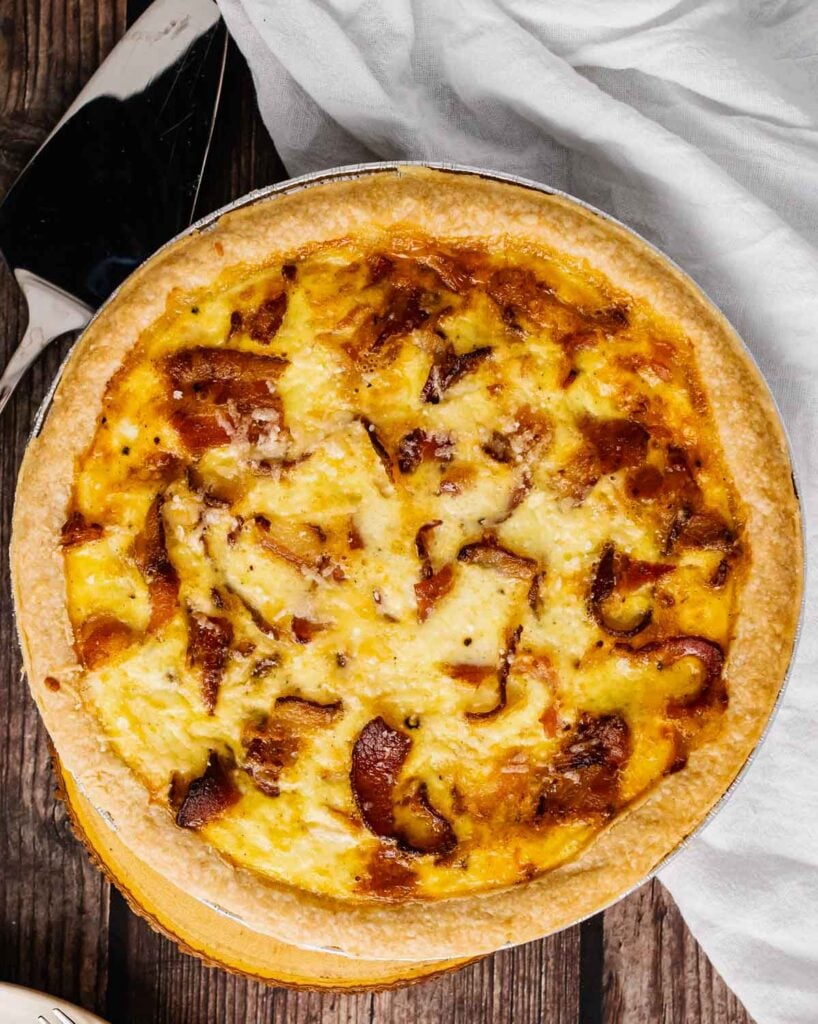 Overhead photograph of Bacon Cheddar Quiche in a prepared pie crust.
