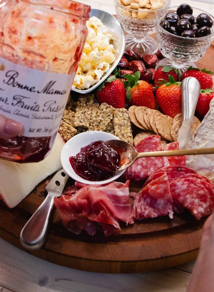 Fruit jam with meat and cheese for Valentines Day Board.