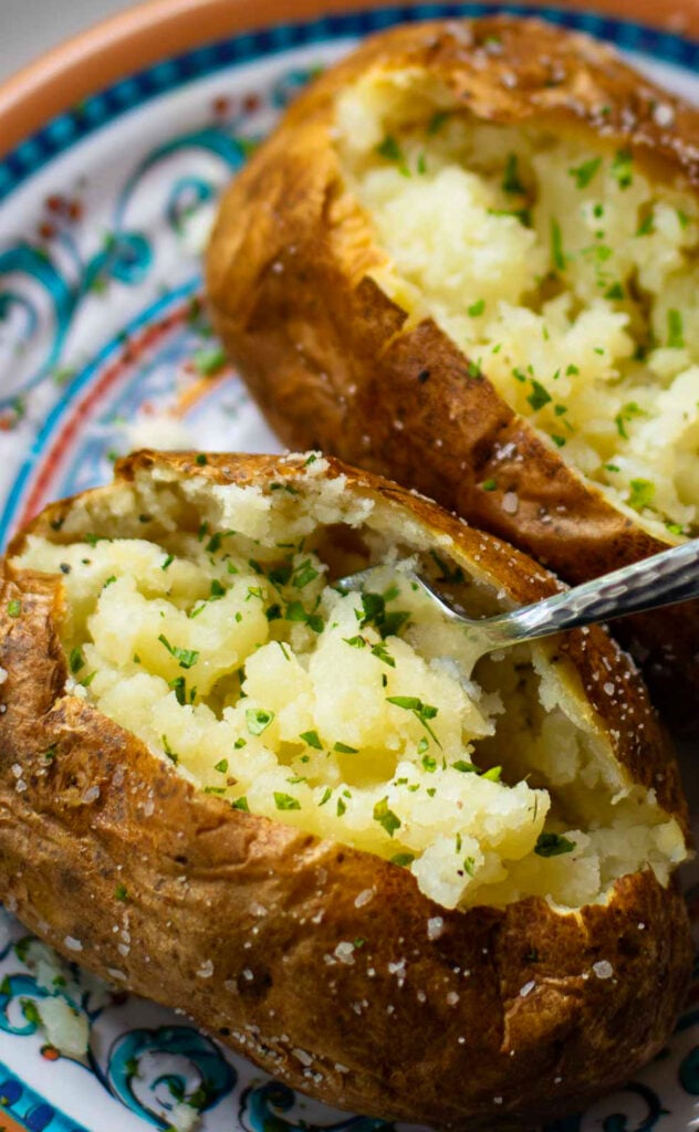 Air Fryer Baked Potatoes are soft on the inside with an irresistible crispy skin.